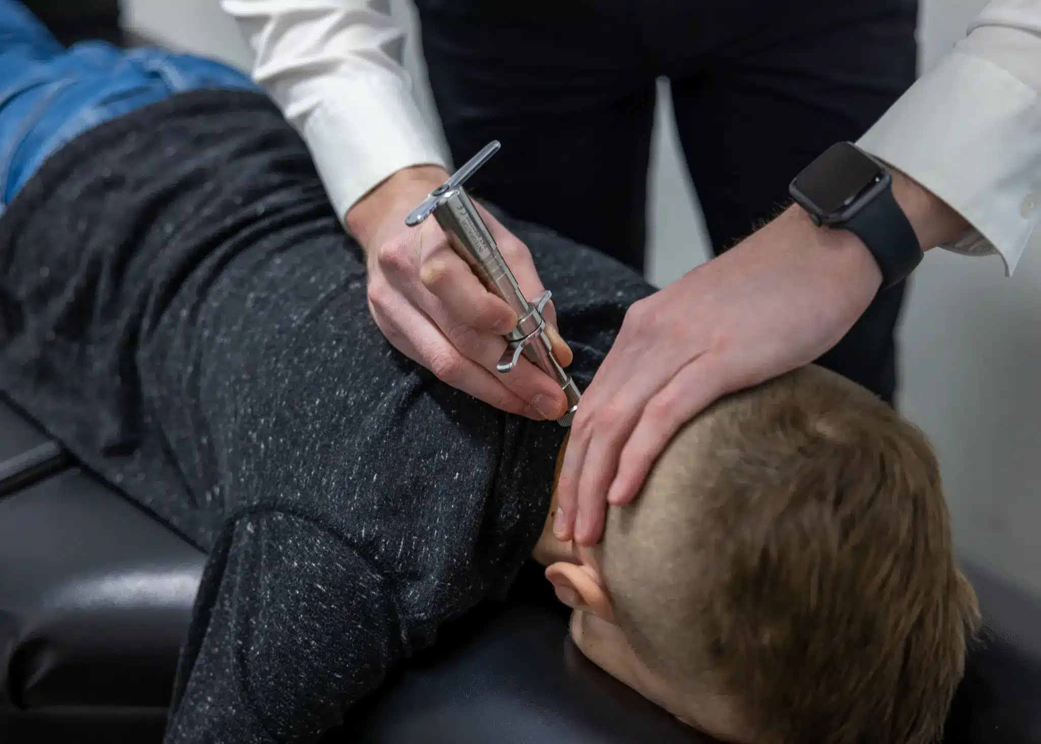 Child receiving a light, precise first pediatric chiropractic adjustment at Restoration Chiropractic in Prosper, TX