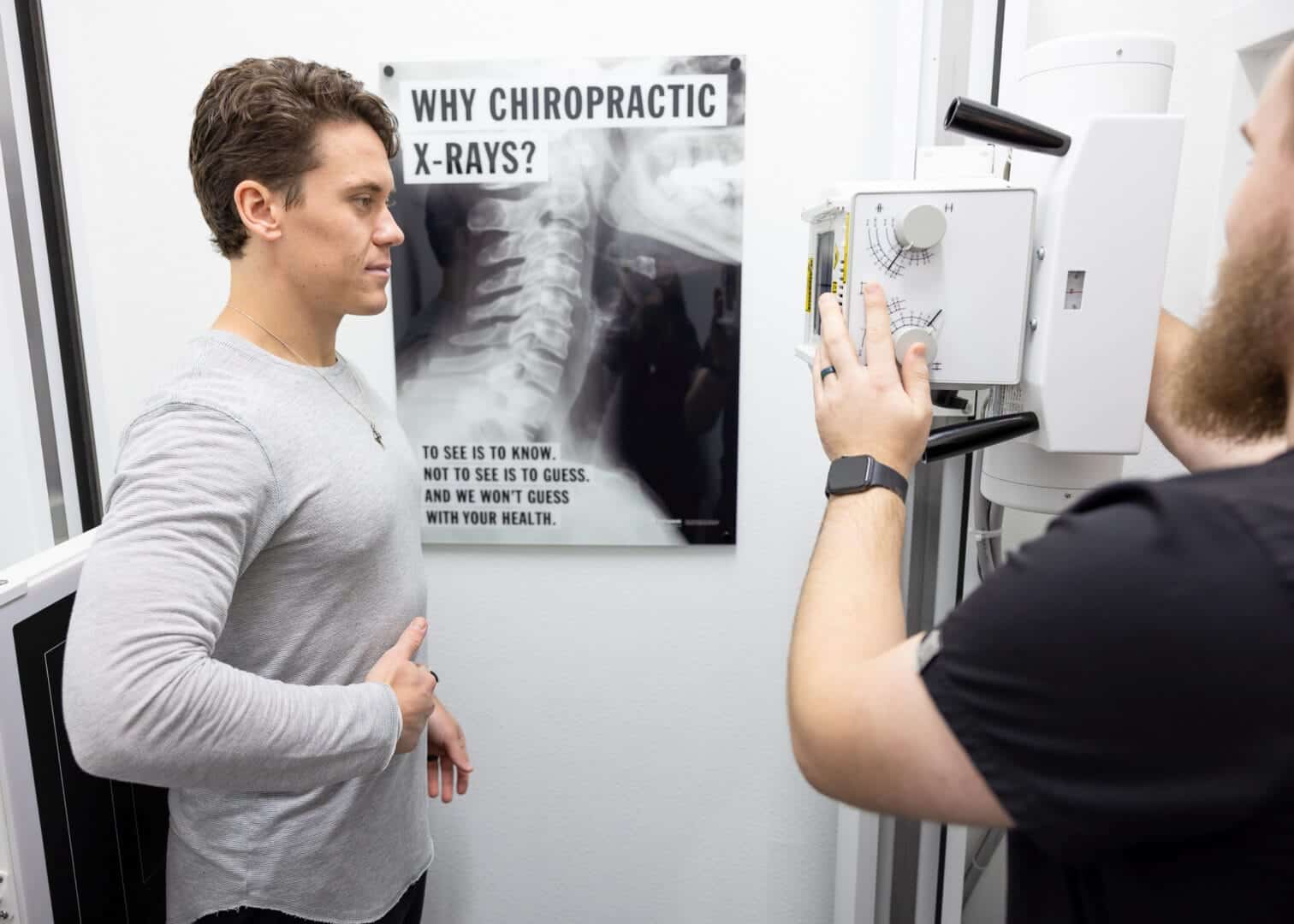 Patient receiving a digital X-ray at Restoration Chiropractic in Prosper, TX