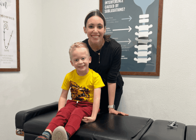 ICPA-trained pediatric chiropractor adjusting a child at Restoration Chiropractic in Prosper, TX