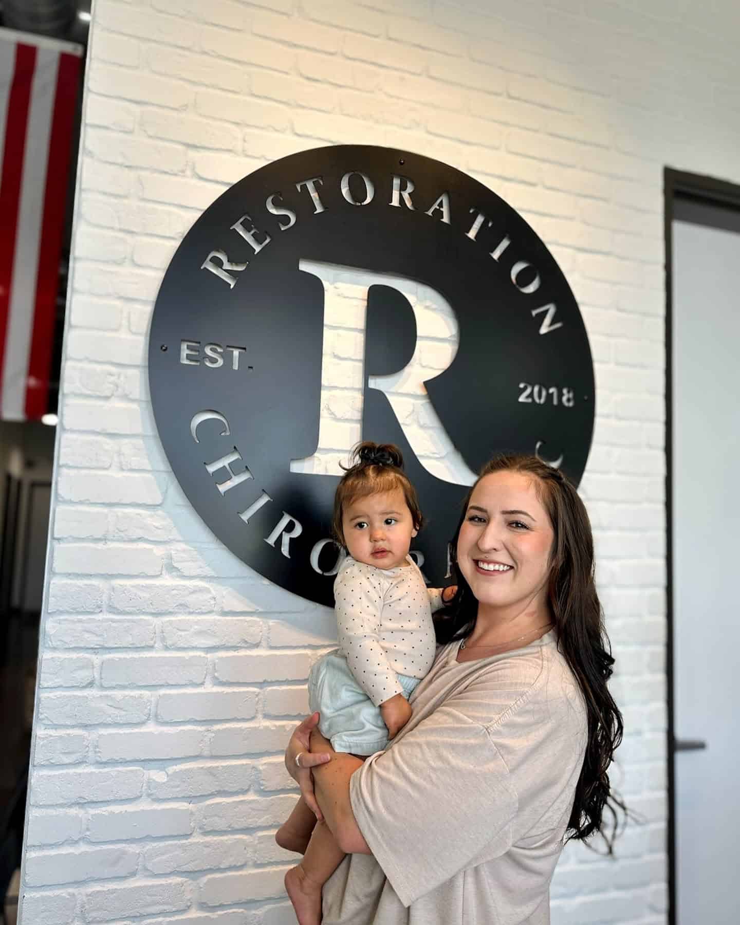 ICPA-certified baby chiropractor gently caring for an infant at Restoration Chiropractic in Prosper, TX