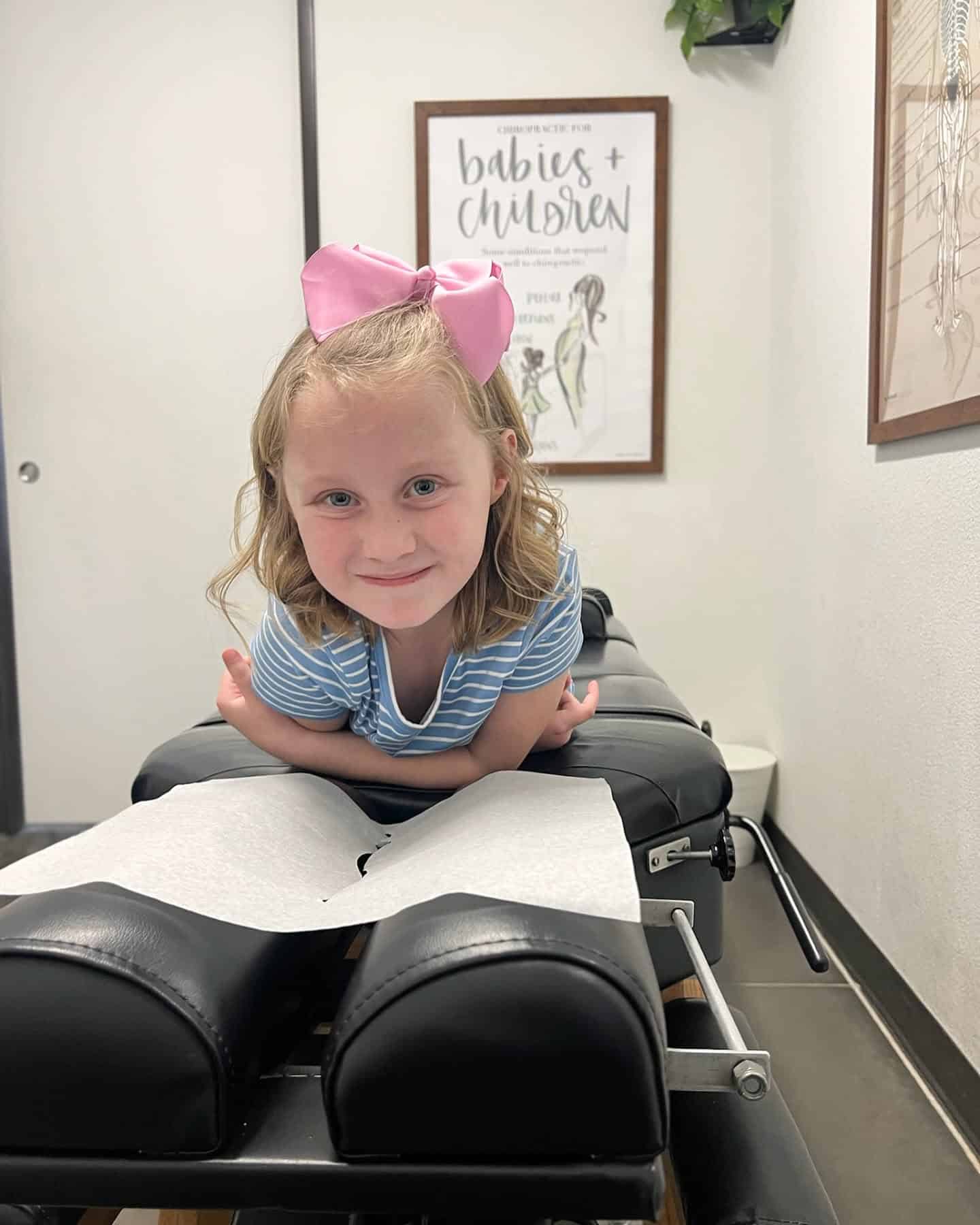 ICPA-certified pediatric chiropractor providing gentle, age-specific care to a child at Restoration Chiropractic in Prosper, TX