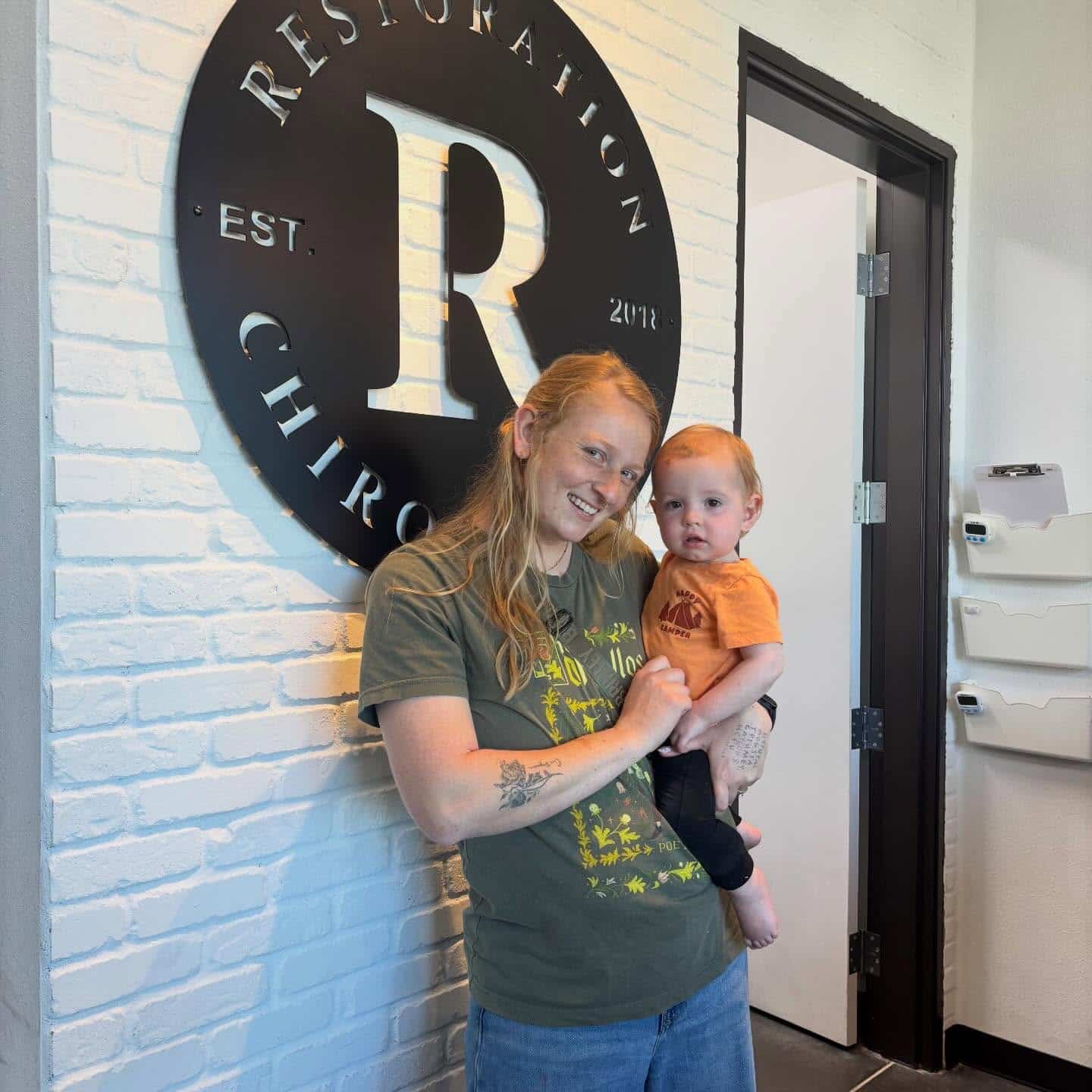 Pregnancy chiropractor in Prosper, TX providing gentle postpartum care for a new mom